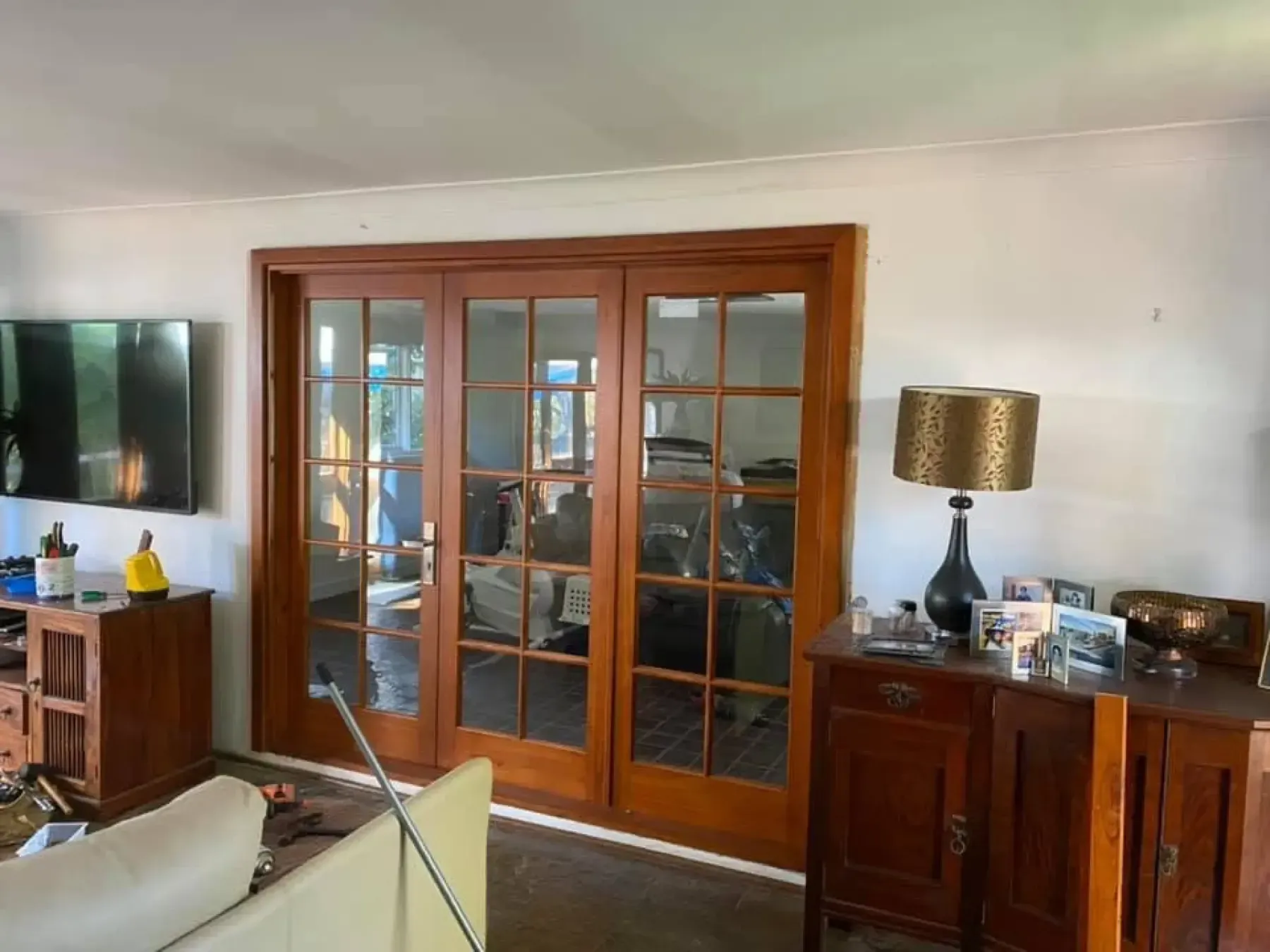Pair of timber-framed glass internal doors in a living room
