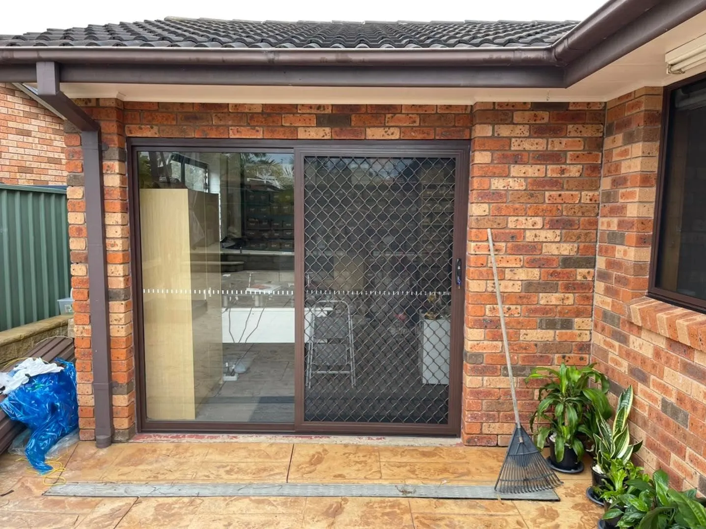 The same opening fitted with an aluminium sliding glass door