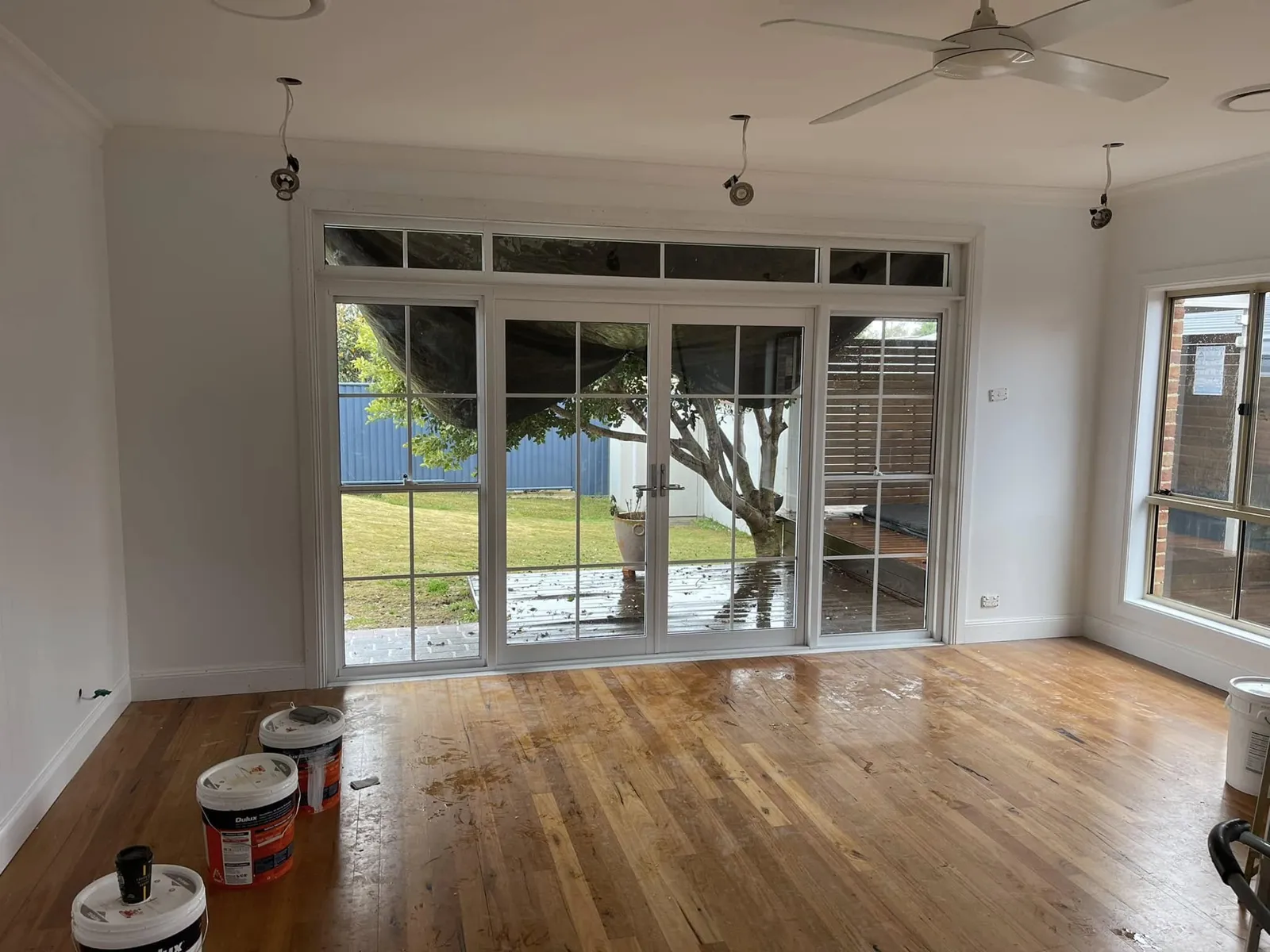 The finished opening with glazed French doors and windows